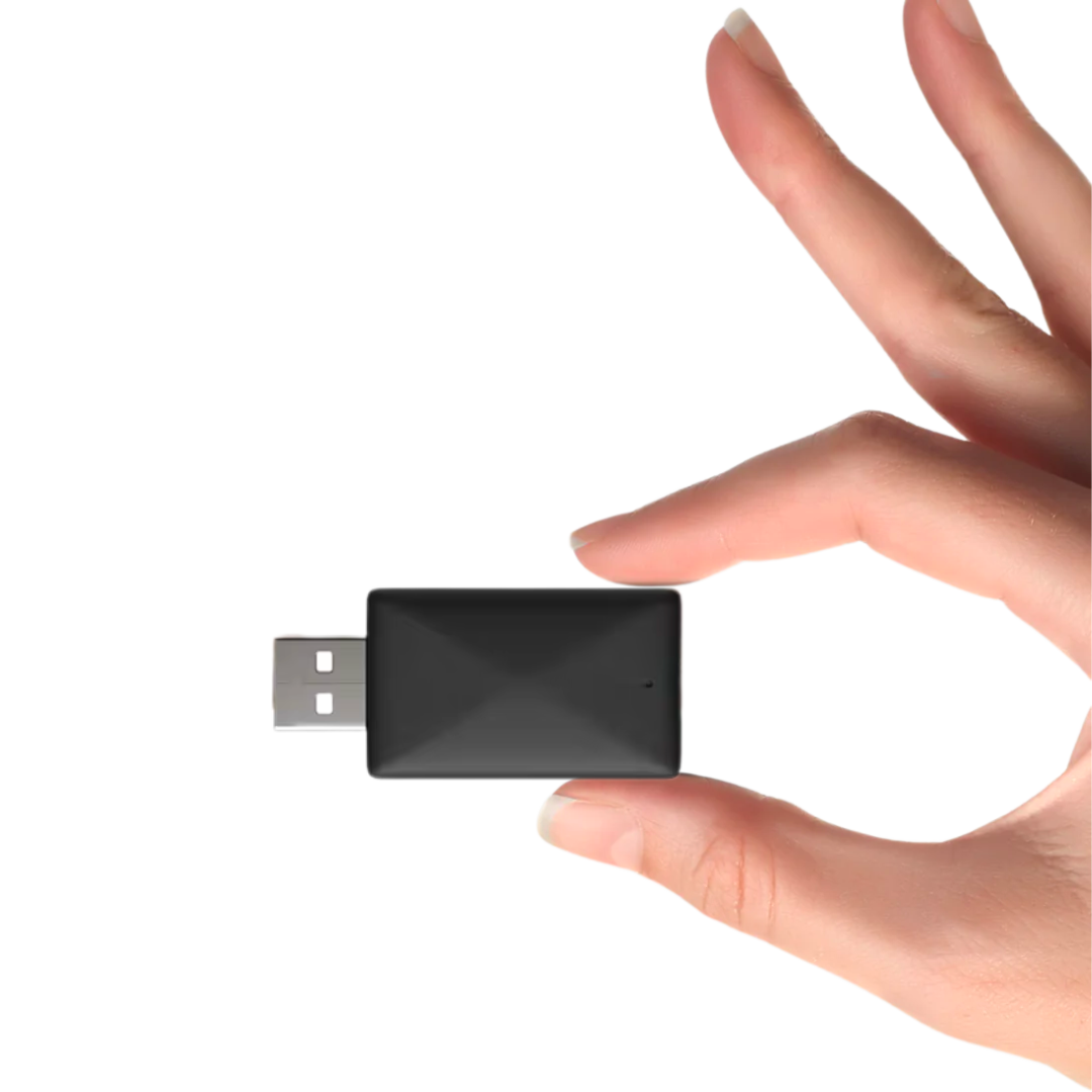 Hand holding a sleek Wireless Apple CarPlay & Android Auto Adapter, showcasing its compact design.